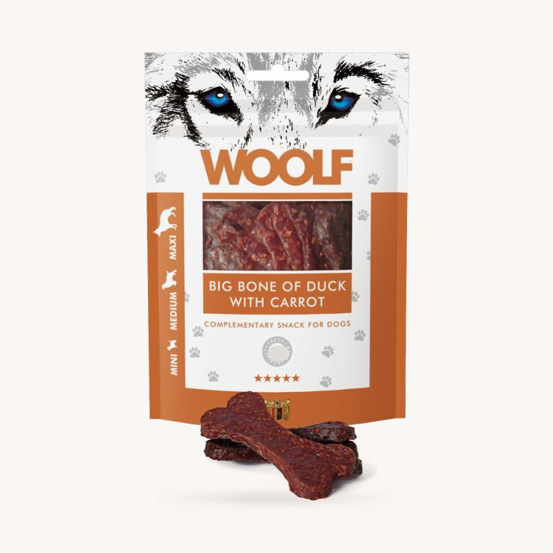 Woolf Big Duck and Carrot Bone soft treats beside the 100g pack