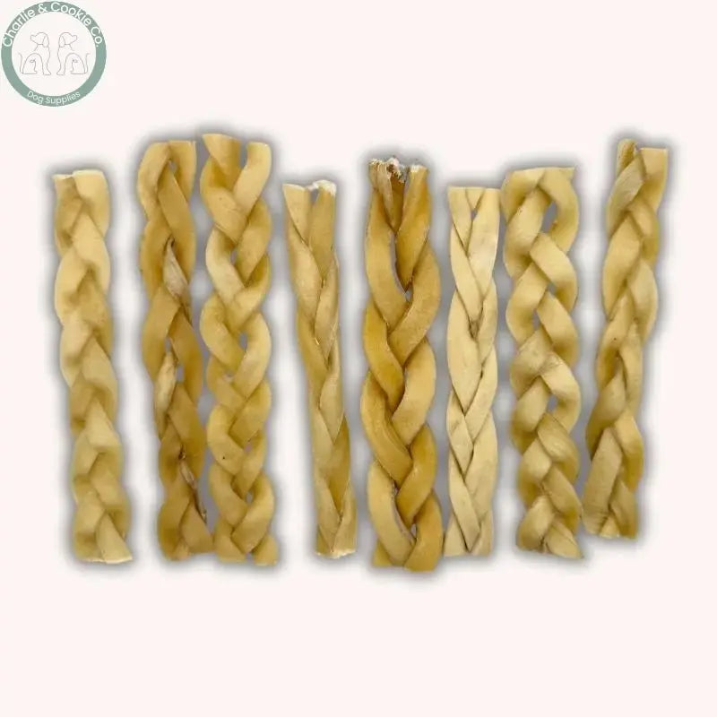 C&amp;C Braided Beef Skin Dog Chews shown with other natural dog treats