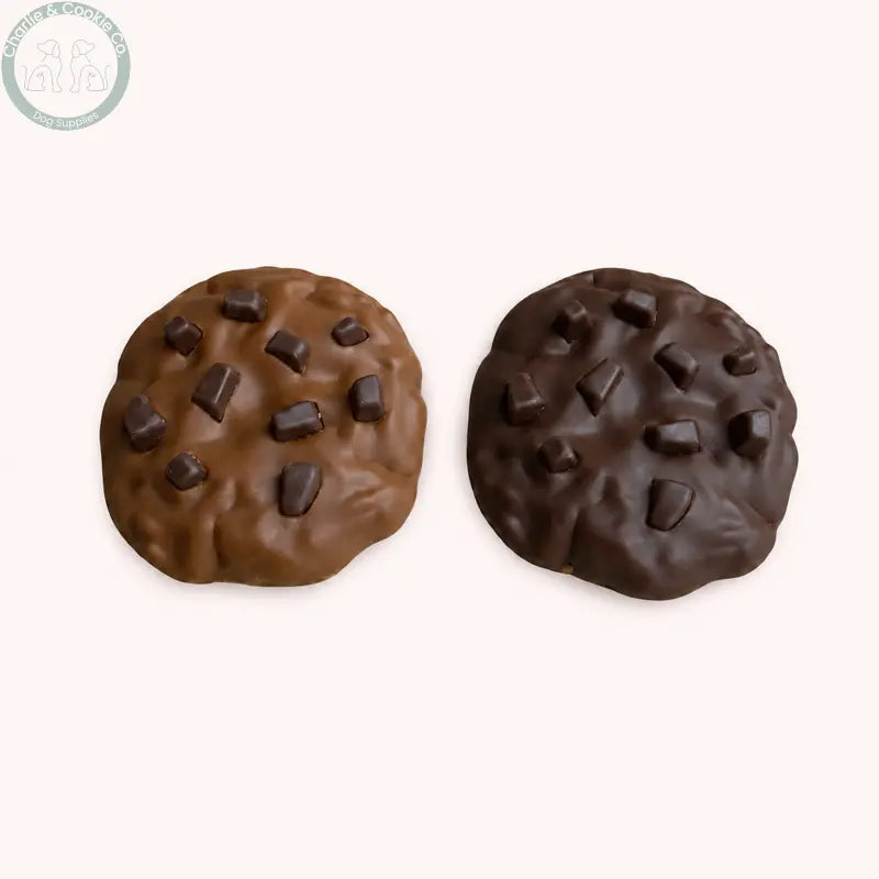 Top view of Maks Patch 7cm Carob and Peanut Butter dog cookies on a soft blush background