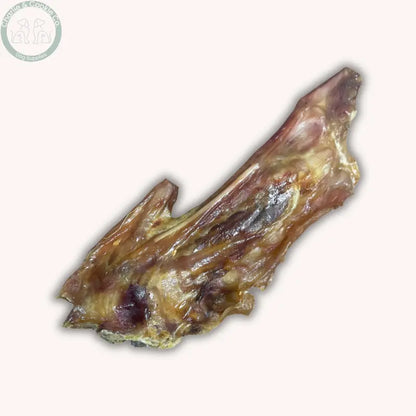 Close-up of a single Paddock Farm turkey wing dog chew